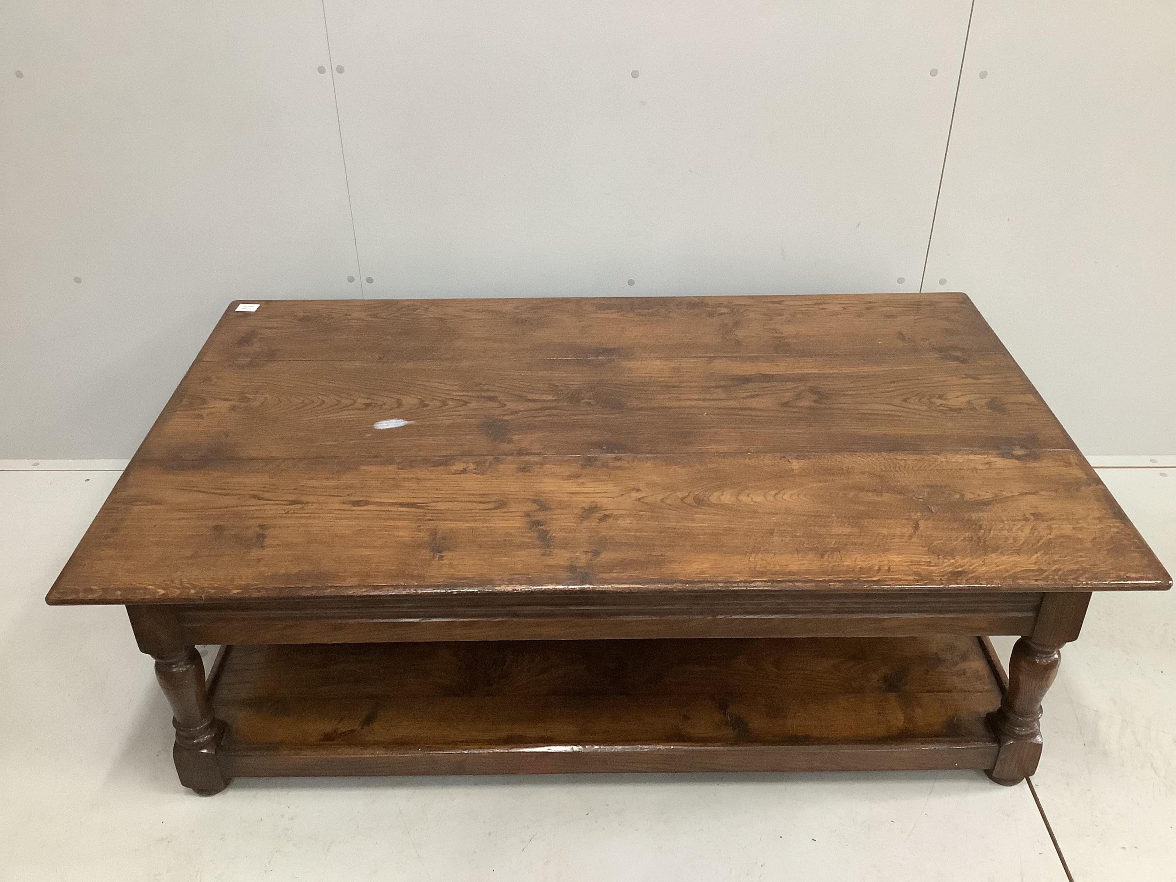 A large reproduction rectangular oak two tier coffee table, width 152cm, depth 92cm, height 49cm. Condition - good